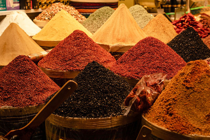 mounds of different colored spices