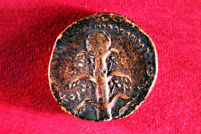 ancient coin on red background