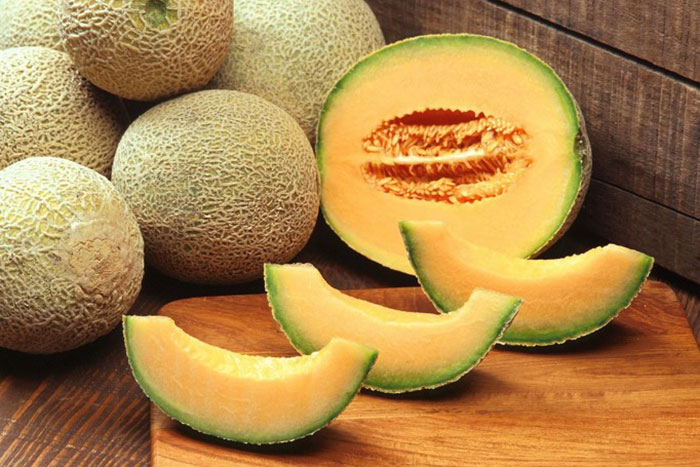 whole, halved and slices of melon