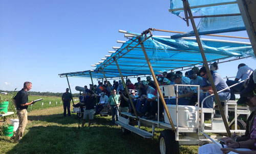 attendees on a guided wagon tour given by Dr. Kevin Bradley