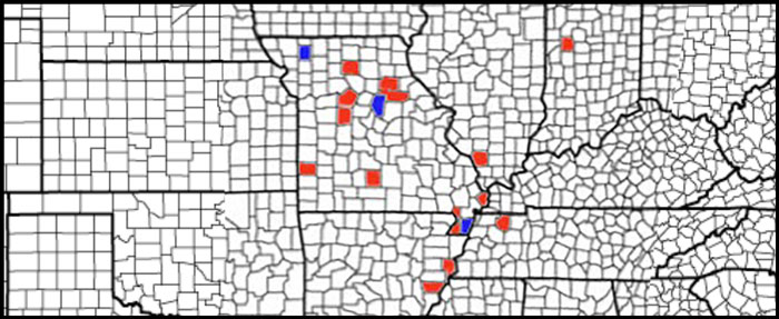 outline map of counties in midwest with a few red and blue counties throughout