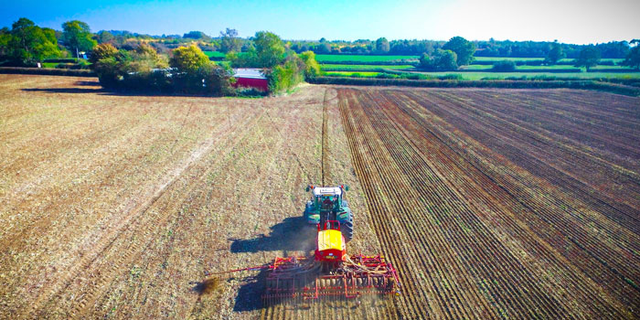 tractor in field planting corn