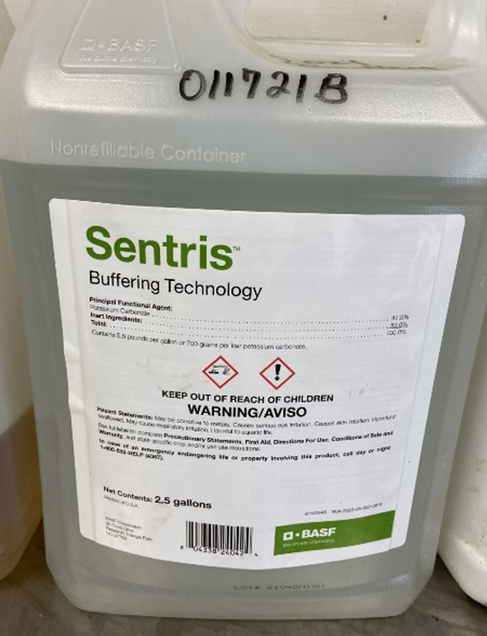 bottle of clear liquid labeled Sentris