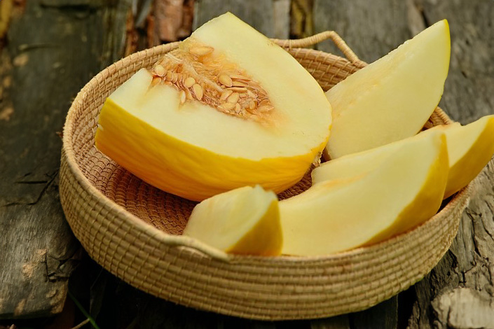 sliced yellow melon in a bowl