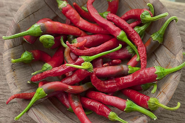 bowl of long red peppers